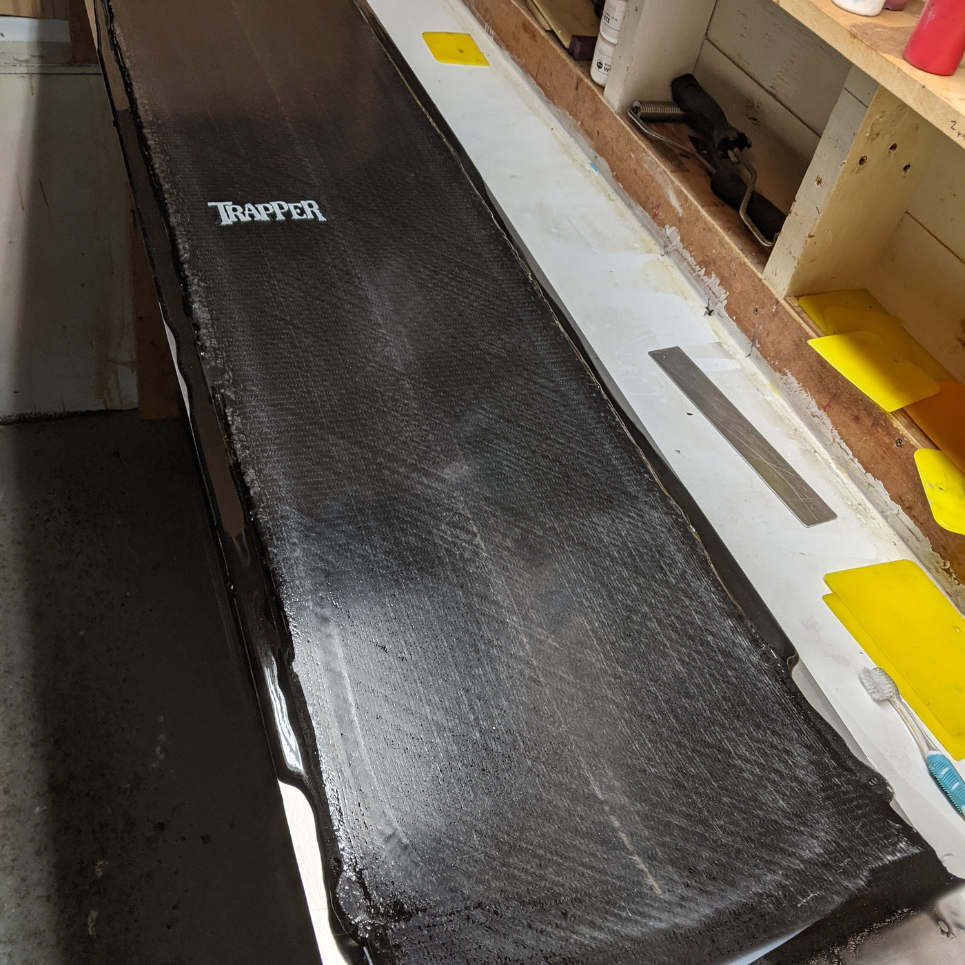Custom power and carving snowboard with black resin tint